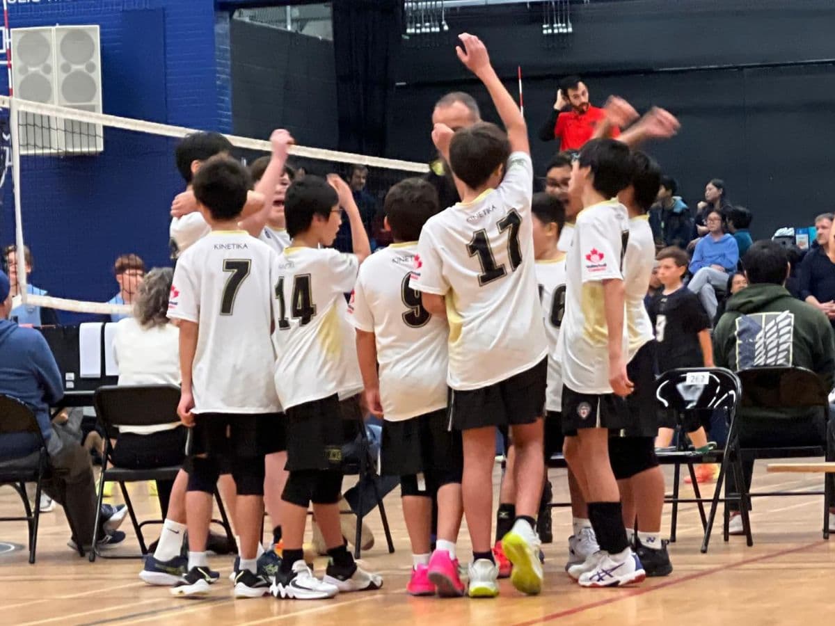 Boys in a game huddle